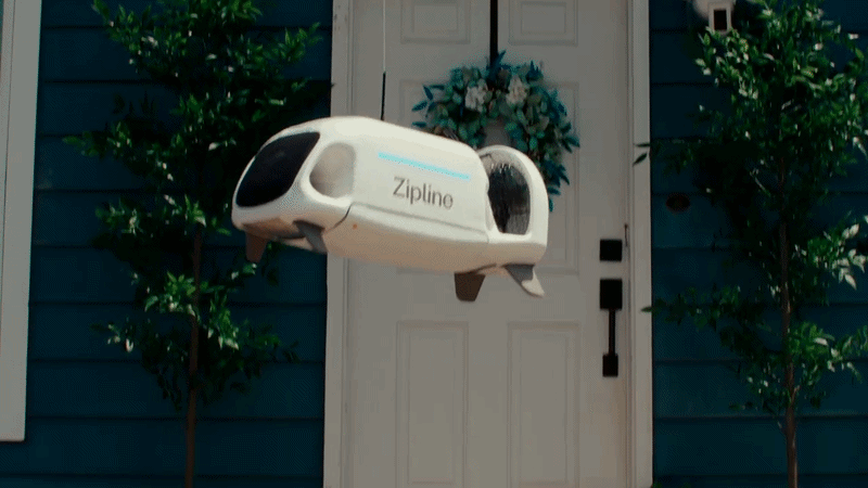 Animated clip of a white Zipline delivery drone hovering at a front door.